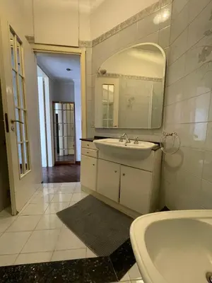 a bathroom with a sink and a tub and a mirror at St Peter view House Vatican in Rome