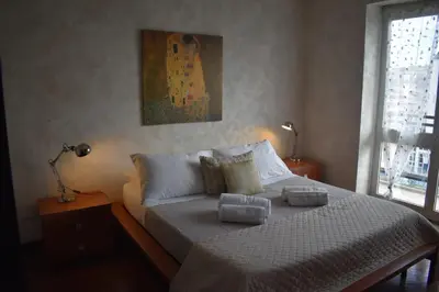 a bedroom with a bed with pillows on it at St Peter view House Vatican in Rome