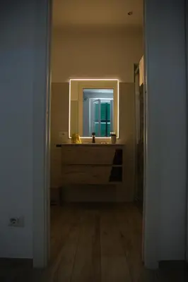 a bathroom with a sink and a mirror at Via Rocca House in Rome