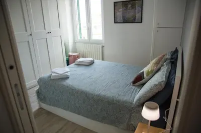 a bedroom with a bed with two towels on it at Via Rocca House in Rome
