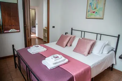 a bedroom with a bed with towels on it at La Casa di SilvAnna in Rome