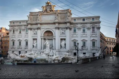 a large building with a fountain in front of it at City Lights Rome in Rome