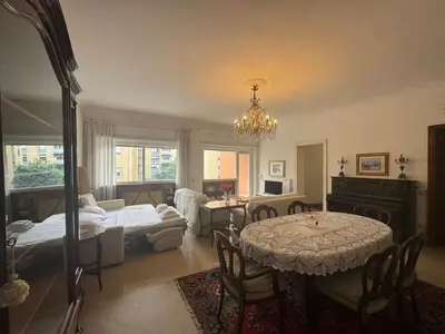 a living room with a table and a dining room at Spacious Getaway with Roman Charm in Rome