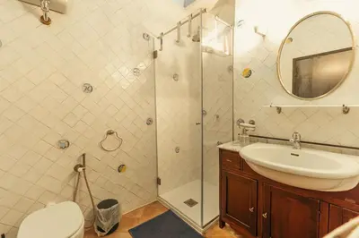a bathroom with a shower and a sink and a toilet at Casa di NOAH in Rome