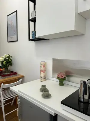 a kitchen with a white counter top and a stove at MarVal Vatican House in Rome