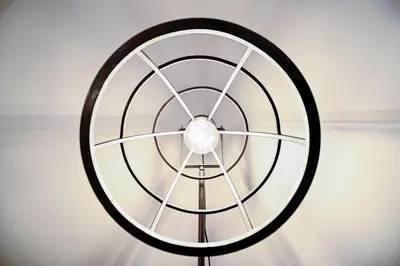 a large black and white wheel on a wall at Why Not Apartment in Rome