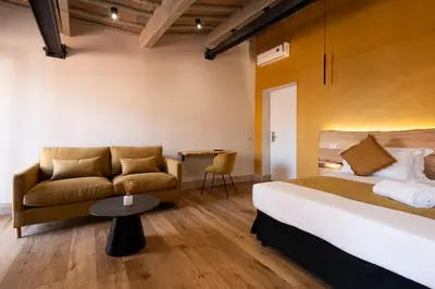 a hotel room with a bed and a couch at Terrace 34 in Rome