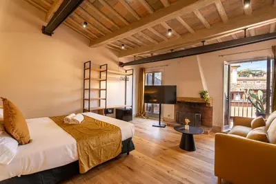 a bedroom with a bed and a tv and a couch at Terrace 34 in Rome