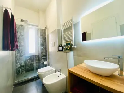 a bathroom with a sink and a toilet and a shower at Domus 14 in Rome