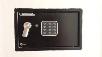 a remote control sitting on top of a table at Grandis Rooms in Rome