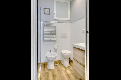 a bathroom with a toilet and a sink at La Dimora di Piazza Navona in Rome