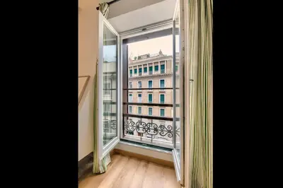 an open window with a view of a building at La Dimora di Piazza Navona in Rome