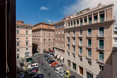 a view of a city street with cars and buildings at La Dimora di Piazza Navona in Rome