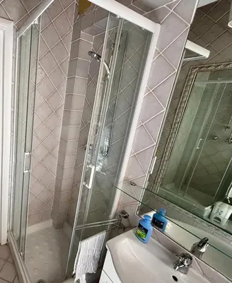 a bathroom with a shower and a sink and a mirror at Atelier ed Affreschi a Campo de Fiori in Rome
