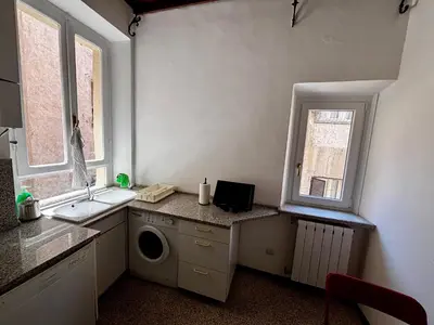a kitchen with a sink and a washing machine at Atelier ed Affreschi a Campo de Fiori in Rome