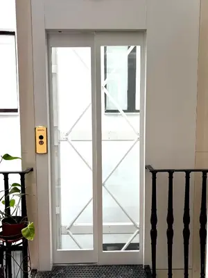 a sliding glass door in a room with a staircase at Atelier ed Affreschi a Campo de Fiori in Rome