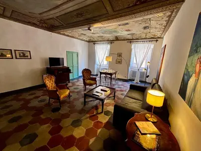 a living room with a couch and chairs at Atelier ed Affreschi a Campo de Fiori in Rome