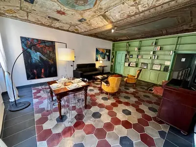 a living room with a couch and a table in it at Atelier ed Affreschi a Campo de Fiori in Rome