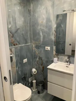 a bathroom with a toilet and a sink at Principe Umberto piano terra in Rome