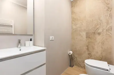a bathroom with a toilet and a sink at Aventino Urban Place by One Up Hospitality in Rome