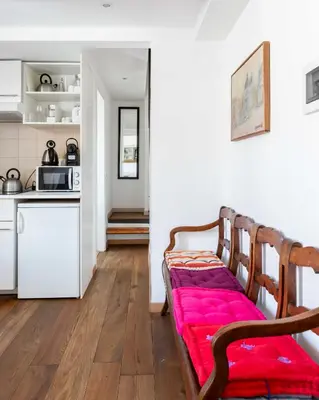 a living room with a bench with a red blanket at Mini apartment Cairoli 2 - Zeno 42 in Rome