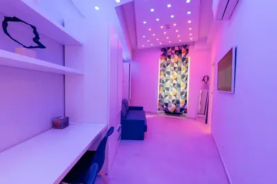 a room with pink lights and a corridor at 30' Walk Vatican & Stadium Art, Smart Home in Rome