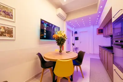 a small dining room with a table and chairs at 30' Walk Vatican & Stadium Art, Smart Home in Rome
