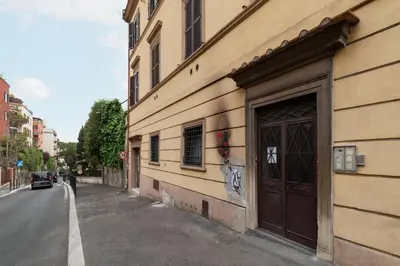 a building with a door on the side of a street at GuestHost - Comfy Apartment near Vatican City! in Rome