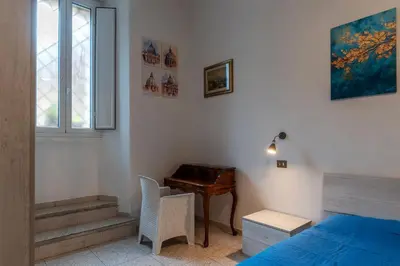 a bedroom with a desk and a bed and a window at GuestHost - Piazzale Clodio Apartment in Rome
