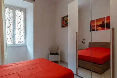 a bedroom with two beds and a glass wall at GuestHost - Piazzale Clodio Apartment in Rome
