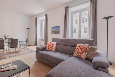 a living room with a couch and a table at Life Home Vatican in Rome