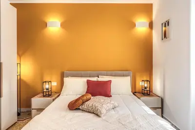 a bedroom with a large bed with two night stands at Clodio Guest House in Rome