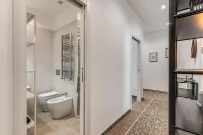a bathroom with a toilet and a sink at Clodio Guest House in Rome