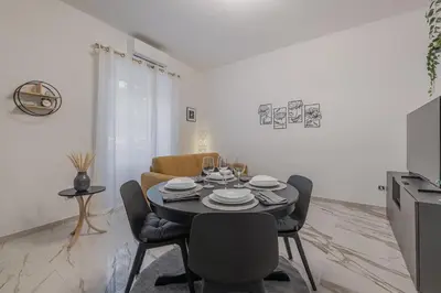 a dining room with a table and chairs at Petit House Roma in Rome