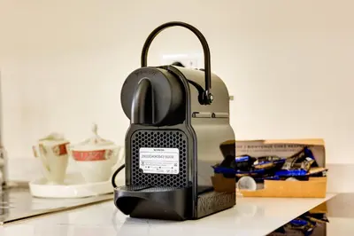 a iron is sitting on a counter next to a box at Dimora Merulana 183 in Rome