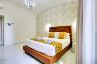 a bedroom with a large bed in a room at Dimora Merulana 183 in Rome