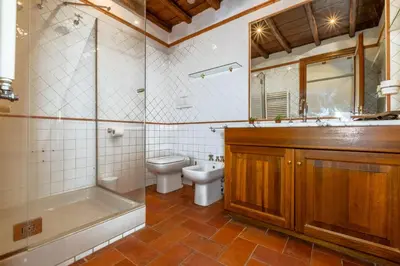 a bathroom with a toilet and a tub and a sink at Trevi Room in Rome