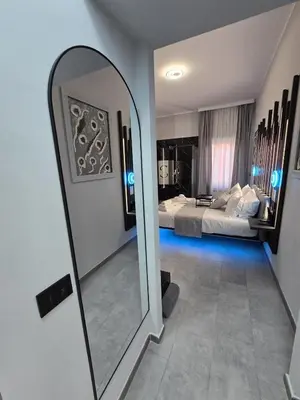 a bedroom with a bed with towels on it at HeySuite -Luxury Vatican House- ROMA Centro Storico in Rome