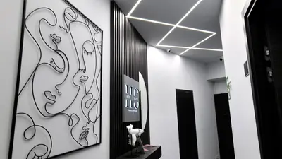 a mirror in a room with a bedroom and a bed at HeySuite -Luxury Vatican House- ROMA Centro Storico in Rome