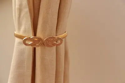 a curtain with a gold knot on it at MM Trevi Apartment in Rome