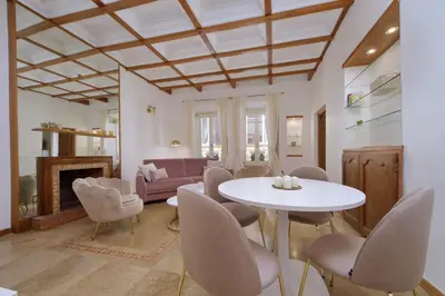 a living room with a table and chairs and a couch at MM Trevi Apartment in Rome