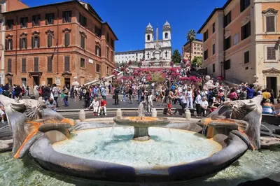 a fountain in a city with a crowd of people at MM Trevi Apartment in Rome
