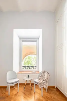 a room with two chairs and a window at Nido degli Artisti in Trastevere Piazza Trilussa in Rome