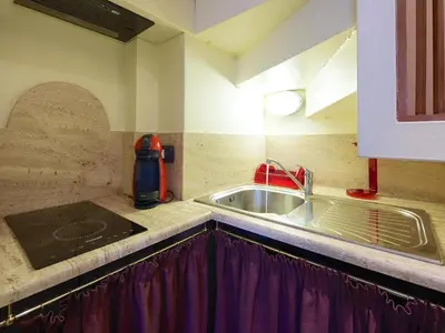 a kitchen with a sink and a counter top at Sweet Home Colosseum in Rome