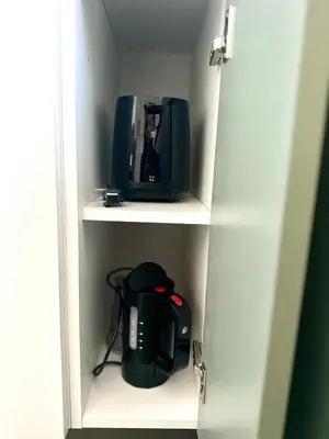 a cabinet with a tv and a radio in it at Beautiful Penthouse Roma in Rome