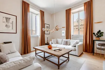 a living room with a couch and a coffee table at Unique Piazza Navona 2 Bedrooms and Home Cinema in Rome