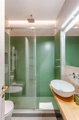 a bathroom with a glass shower and a sink at Unique Piazza Navona 2 Bedrooms and Home Cinema in Rome