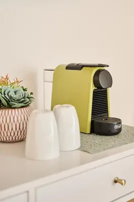 a yellow toaster sitting on top of a kitchen counter at BellaRoma NAVONA Guest house in Rome