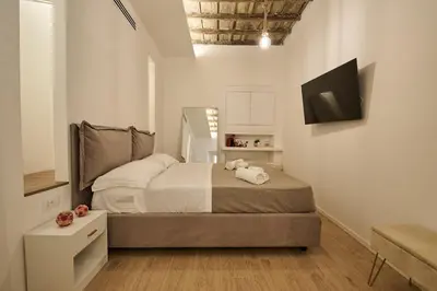 a small bedroom with a bed in a room at BellaRoma NAVONA Guest house in Rome