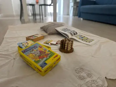 a table with games and books on top of a table at Silvestri206 in Rome